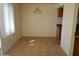 Bright dining area with tile flooring, window, and a chandelier, perfect for intimate meals and gatherings at 5221 N 42Nd Ln, Phoenix, AZ 85019