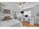 Bedroom with hardwood floors, natural lighting and spacious white desk setup at 5615 W Tonopah Dr, Glendale, AZ 85308