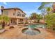 Resort-style pool and spa area with lush landscaping and a basketball hoop, perfect for outdoor relaxation and fun at 5615 W Tonopah Dr, Glendale, AZ 85308