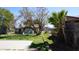 Long backyard with a play structure and a trampoline at 6212 S 12Th St, Phoenix, AZ 85042