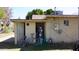 Exterior view of utility area with a shed door, hot water tank, and exterior storage at 6212 S 12Th St, Phoenix, AZ 85042