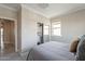 Cozy bedroom with neutral colors, a mirrored closet, and natural light, creating a serene and inviting atmosphere at 631 E Peach Tree St, Queen Creek, AZ 85140