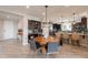 Dining area adjacent to kitchen, features modern chandelier lighting and barstool seating at 631 E Peach Tree St, Queen Creek, AZ 85140