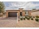 Charming single-story home featuring a tile roof, desert landscaping, and a two-car garage at 631 E Peach Tree St, Queen Creek, AZ 85140