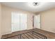 Bedroom with wood-look tile flooring, a ceiling fan and a large closet at 6829 S 58Th Ave, Laveen, AZ 85339