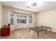 Bedroom with wood-look tile flooring, a ceiling fan and a large bay window at 6829 S 58Th Ave, Laveen, AZ 85339