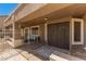 Charming covered patio with decorative double doors and privacy lattice, perfect for outdoor relaxation at 6829 S 58Th Ave, Laveen, AZ 85339