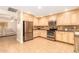 Well-equipped kitchen featuring stainless steel appliances and custom cabinetry at 6842 N 10Th Pl, Phoenix, AZ 85014