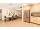 Kitchen featuring stainless steel refrigerator, tile floors, dining table, and breakfast nook at 6842 N 10Th Pl, Phoenix, AZ 85014