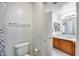 Bathroom featuring a toilet, doorway to a vanity area, and neutral-colored walls at 7317 W Southgate Ave, Phoenix, AZ 85043