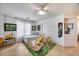 Bright bonus room features light wood flooring, a ceiling fan, and great natural light at 7317 W Southgate Ave, Phoenix, AZ 85043