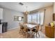 Inviting dining area with natural light, a chandelier, and a view of the outside at 7317 W Southgate Ave, Phoenix, AZ 85043