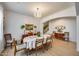 Dining room with a chandelier and light-colored wood floors at 7317 W Southgate Ave, Phoenix, AZ 85043