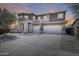 Beautiful two-story home with three-car garage and well-manicured front yard at 7317 W Southgate Ave, Phoenix, AZ 85043