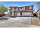 Beautiful two-story home with three-car garage and a meticulously maintained front yard at 7317 W Southgate Ave, Phoenix, AZ 85043