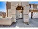 Inviting front entrance with decorative archway and charming white front door at 7317 W Southgate Ave, Phoenix, AZ 85043