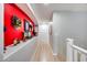 Upstairs hallway with bright accent wall and recessed display shelf for decorations at 7317 W Southgate Ave, Phoenix, AZ 85043