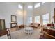 Bright living room with clerestory windows and light-colored wood floors at 7317 W Southgate Ave, Phoenix, AZ 85043