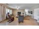 Comfortable living room with neutral tones, a ceiling fan, and plenty of seating at 7317 W Southgate Ave, Phoenix, AZ 85043