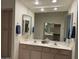 Bathroom featuring double sinks, a large mirror, and ample storage space at 7361 E Rugged Ironwood Rd, Gold Canyon, AZ 85118