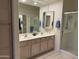 Spacious bathroom with double sinks, a large mirror, and a separate shower at 7361 E Rugged Ironwood Rd, Gold Canyon, AZ 85118