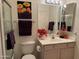 Bright bathroom featuring a vanity, a floral painting, and a shower with glass doors at 7361 E Rugged Ironwood Rd, Gold Canyon, AZ 85118