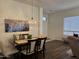 Inviting dining room featuring a stylish light fixture and dark wood table perfect for Gathering meals at 7361 E Rugged Ironwood Rd, Gold Canyon, AZ 85118