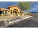 The entrance to the building with a covered walkway and surrounding desert landscaping at 7361 E Rugged Ironwood Rd, Gold Canyon, AZ 85118