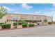 Exterior view of the Superstition Center building with lush landscaping at 7361 E Rugged Ironwood Rd, Gold Canyon, AZ 85118