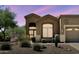 Inviting single-story home features desert landscaping and a two-car garage at 7361 E Rugged Ironwood Rd, Gold Canyon, AZ 85118