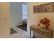 Hallway showcasing a decorative console table and a view to the living area at 7361 E Rugged Ironwood Rd, Gold Canyon, AZ 85118