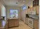 Bright kitchen showcasing an island, double sink, and ample cabinet storage at 7361 E Rugged Ironwood Rd, Gold Canyon, AZ 85118