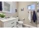 Bright bathroom featuring a marble vanity, neutral walls, and tasteful coastal-themed decor at 7401 W Arrowhead Clubhouse Dr # 2045, Glendale, AZ 85308