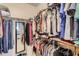 Spacious walk-in closet with ample hanging storage and shelving for organized clothing at 7401 W Arrowhead Clubhouse Dr # 2045, Glendale, AZ 85308