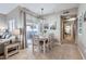 Dining area featuring contemporary lighting and view to outdoor living space at 7401 W Arrowhead Clubhouse Dr # 2045, Glendale, AZ 85308