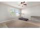 Neutral bedroom featuring wood-look floors, ceiling fan, and an abundance of natural light at 7567 W Andrea Dr, Peoria, AZ 85383