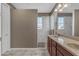 Bathroom featuring double sinks, granite countertops, and a view of the shower stall at 857 S Osborn Ln, Gilbert, AZ 85296