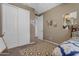 Bedroom with large closet, neutral walls, and a view into the hallway at 857 S Osborn Ln, Gilbert, AZ 85296