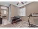 Bedroom featuring brown carpet, a ceiling fan and a large window with blinds at 857 S Osborn Ln, Gilbert, AZ 85296