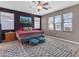 Spacious bedroom with a ceiling fan, natural light from windows and an accent wall at 857 S Osborn Ln, Gilbert, AZ 85296