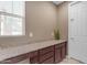 Granite countertop with base cabinets, a window with blinds and a white interior door at 857 S Osborn Ln, Gilbert, AZ 85296