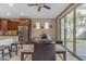 Bright dining area with modern table and chairs, sliding glass doors, and adjacent kitchen features at 857 S Osborn Ln, Gilbert, AZ 85296