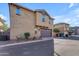 Two-story home featuring a brown garage door and neutral stucco exterior, and simple landscaping at 857 S Osborn Ln, Gilbert, AZ 85296