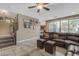 Cozy living room with leather furniture, tiled floor and staircase to the second floor at 857 S Osborn Ln, Gilbert, AZ 85296