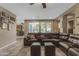 Large living room showcasing tile flooring, comfortable sectional seating, and a bright, airy atmosphere at 857 S Osborn Ln, Gilbert, AZ 85296