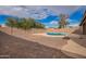 Backyard features a refreshing pool, a durable block fence, and a gravel landscape for low maintenance at 8738 W Mountain View Rd, Peoria, AZ 85345