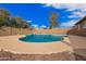 Backyard highlighting a beautiful pool, a low maintenance landscape, and a private wall for enjoyment at 8738 W Mountain View Rd, Peoria, AZ 85345