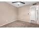 Neutral bedroom with plush carpet and ceiling fan at 8738 W Mountain View Rd, Peoria, AZ 85345