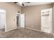 Cozy bedroom featuring neutral colors, carpet, and ample closet space at 8738 W Mountain View Rd, Peoria, AZ 85345