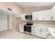 Modern kitchen with stainless steel appliances, plenty of cabinet space, and great lighting at 8738 W Mountain View Rd, Peoria, AZ 85345